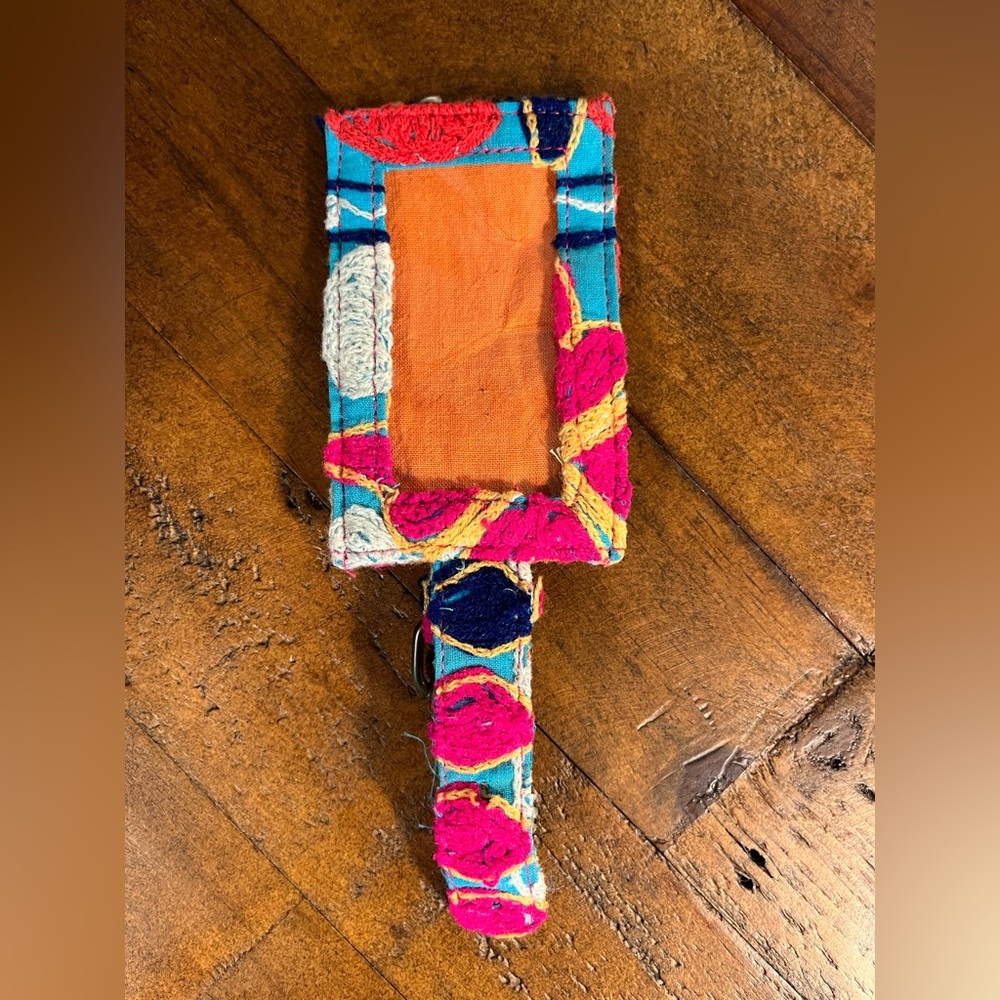 Embroidered luggage tag, gently used